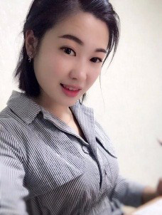 劉*
